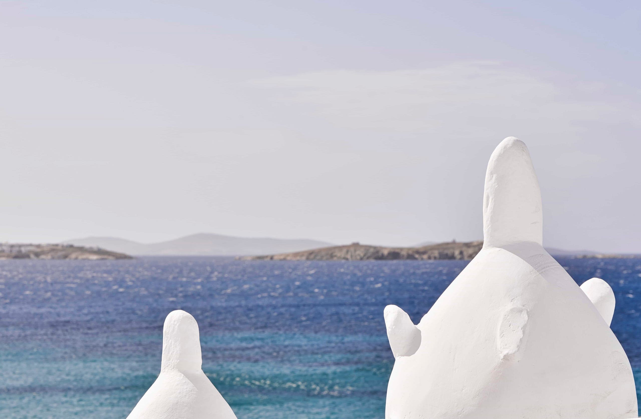 Whitewashed chimneys against the Aegean Sea