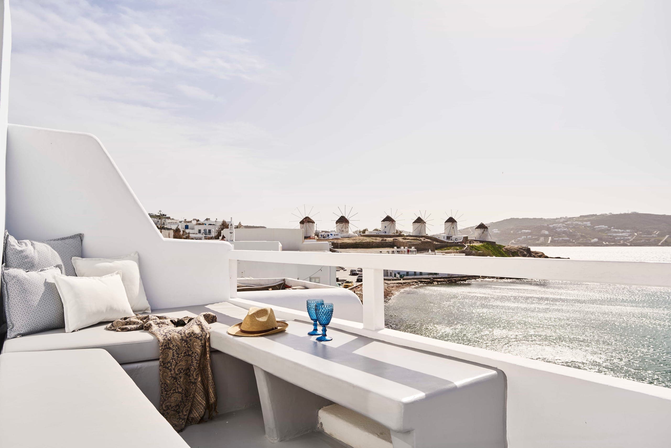 Terrace lounge with cushions looking out to the windmills and the sea
