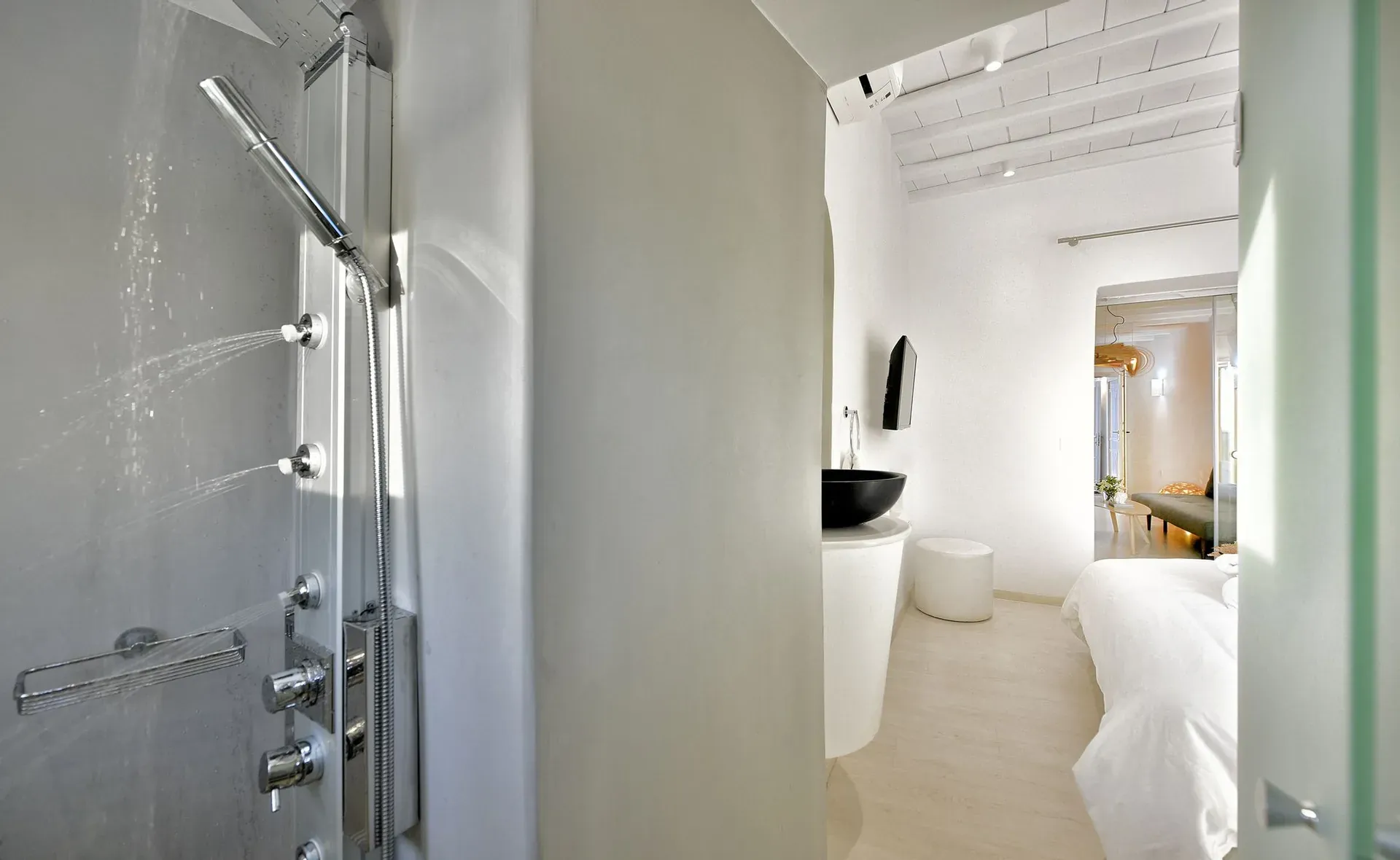 Steam shower with a view through to the bedroom