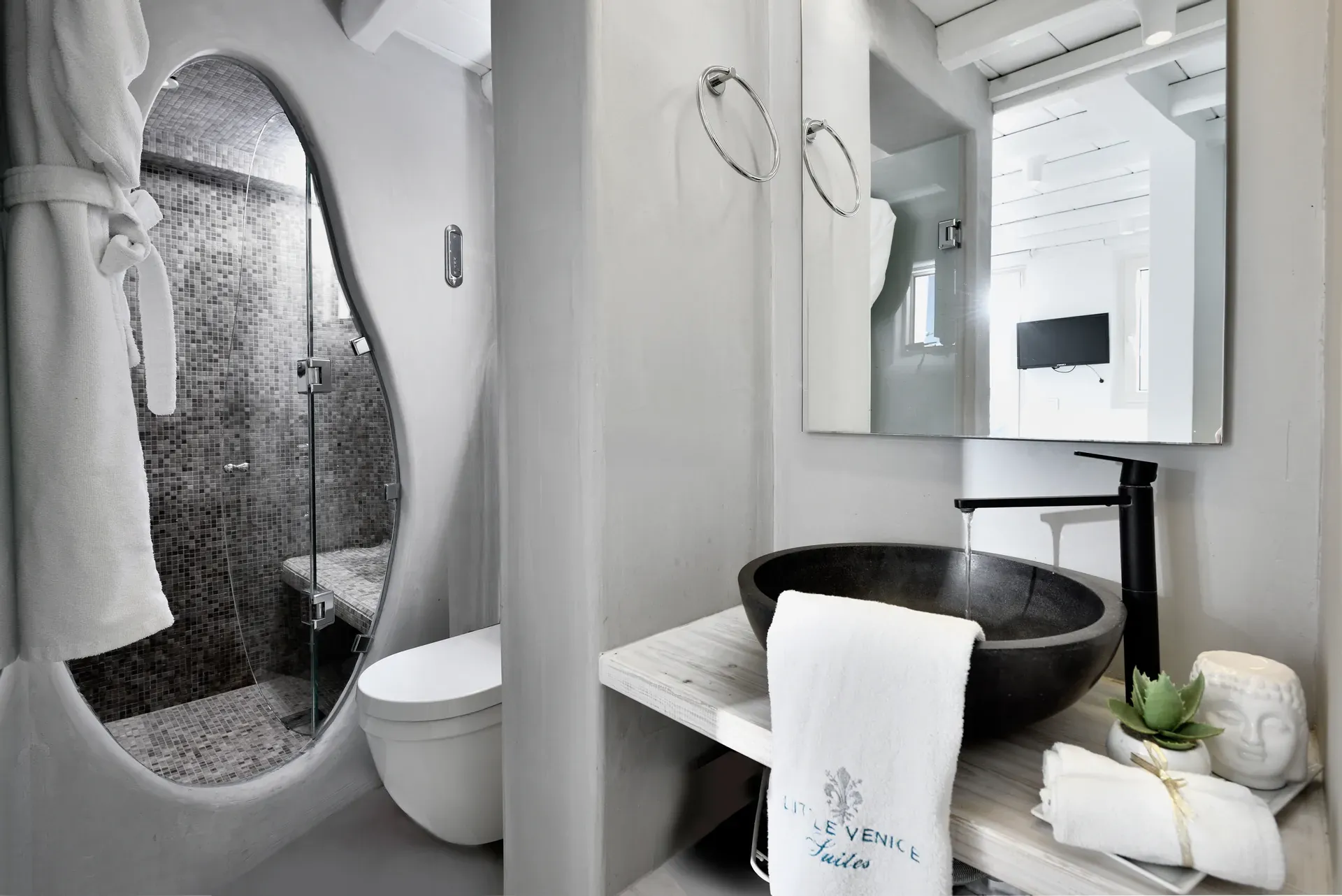 Bathroom with black stone basin and steam shower